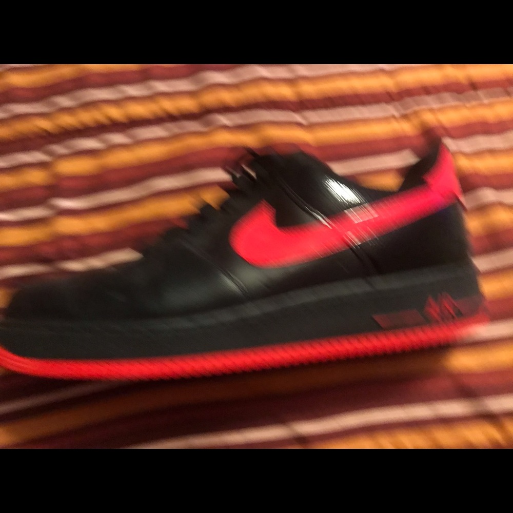 Black and red low top Nike